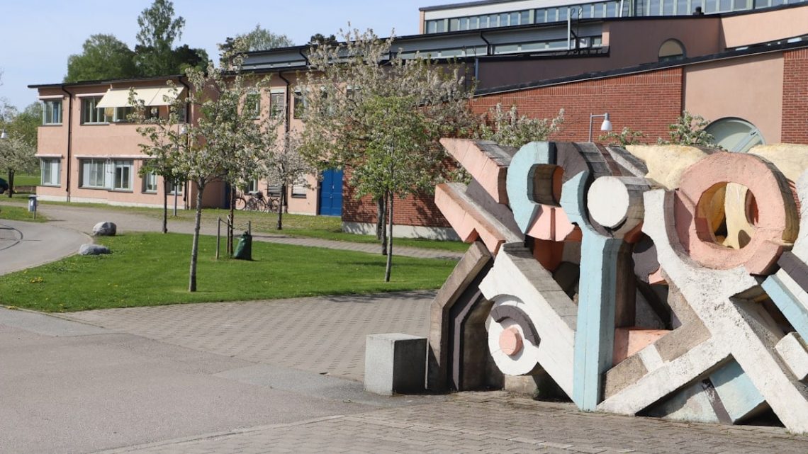 a building with a large sculpture in front of it