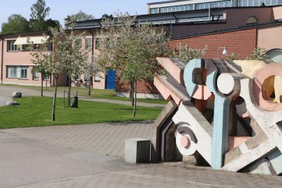 a building with a large sculpture in front of it